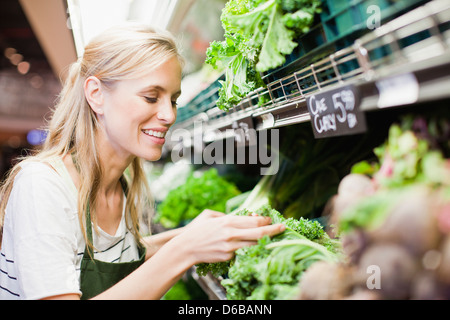 Grocer working in produce section Stock Photo