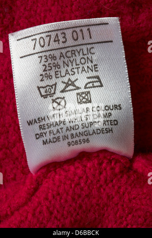 label showing washing instructions in garment made in Bangladesh - sold in the UK United Kingdom, Great Britain, care washing symbols and instructions Stock Photo