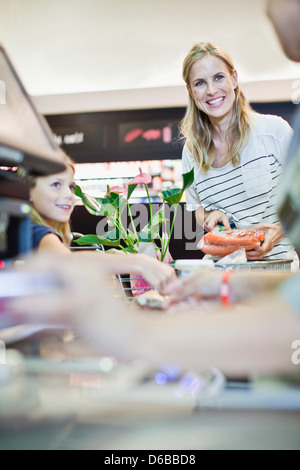 Mother and daughter in grocery store Stock Photo