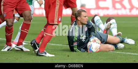 Munich's goalkeeper Manuel Neuer saves a shot during the German Bundesliga soccer match between SpVgg Greuther Fuerth and FC Bayern Munich at the Trolli Arena in Fuerth, Germany, 25 August 2012. Photo: DAVID EBENER (ATTENTION: EMBARGO CONDITIONS! The DFL permits the further  utilisation of up to 15 pictures only (no sequntial pictures or video-similar series of pictures allowed) vi Stock Photo