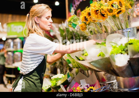 Grocer working in florist section Stock Photo