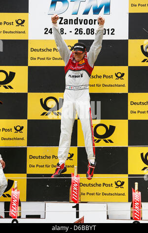 HANDOUT - A handout file dated 26 August 2012 shows Audi pilot Edoardo Mortara of Team Rosberg from Italy celebrating his title during the victory ceremony of the German Touring Car Masters (DTM) after the seventh run in Zandvoort, The Netherlands. Photo: ITR/JUERGEN TAP (ATTENTION: For editorial use only) Stock Photo