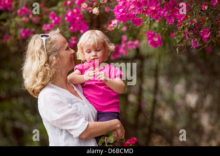 Mother and daughter picking flowers Stock Photo