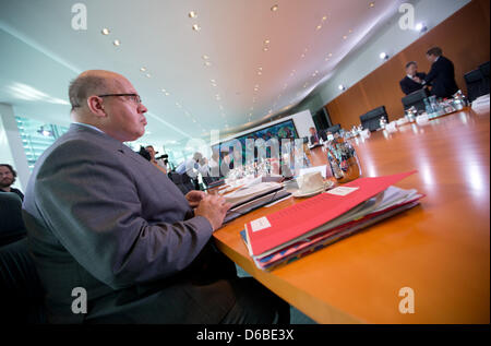 German Minister of the Environment Peter Altmaier (CDU) has taken his seat at the cabinet meeting at the Federal Chancellery in Berlin, Germany, 29 August 2012. Today's topics will be offshore liabilities and a reduction of pension contributions. Photo: Kay Nietfeld Stock Photo