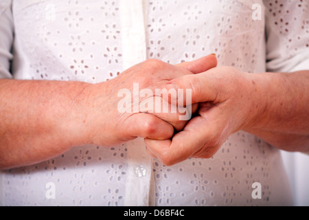 the hands of elderly woman are crossed Stock Photo
