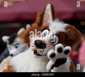 Visitors to the Eurofurence Convention talk in fanciul animal constumes through the inner city of Magdeburg, Germany, 31 August 2012. The 18th Eurofurence convention for furry fans is taking place in Magdeburg until 02 September 2012. Photo: JENS WOLF Stock Photo