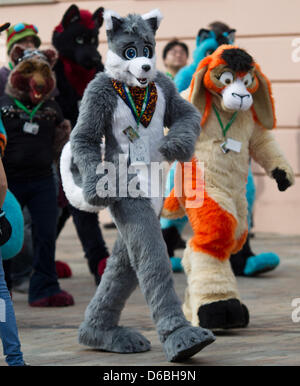 Visitors to the Eurofurence Convention talk in fanciul animal constumes through the inner city of Magdeburg, Germany, 31 August 2012. The 18th Eurofurence convention for furry fans is taking place in Magdeburg until 02 September 2012. Photo: JENS WOLF Stock Photo