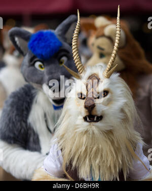 Visitors to the Eurofurence Convention talk in fanciul animal constumes through the inner city of Magdeburg, Germany, 31 August 2012. The 18th Eurofurence convention for furry fans is taking place in Magdeburg until 02 September 2012. Photo: JENS WOLF Stock Photo