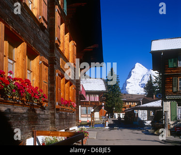 Wooden chalet type houses in Murren, Berneses Oberland, the Eiger in background, Switzerland Stock Photo