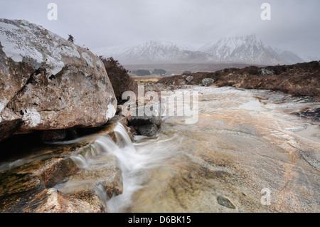 Mini cascade on the Allt a' Bhalaich, with Creise and Meall a Bhuiridh in the background, Glencoe, Scottish Highlands Stock Photo