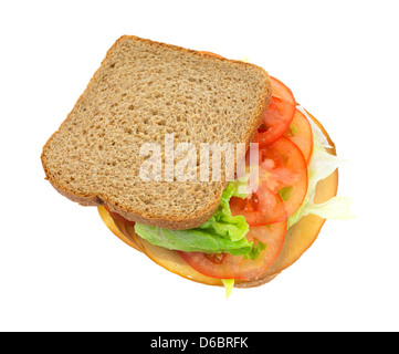 A sandwich of whole wheat bread with lettuce tomatoes and tofu meatless turkey on a white background. Stock Photo