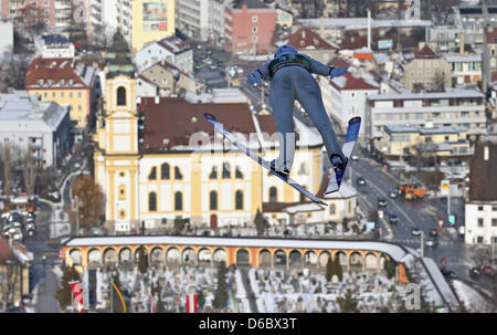 German ski jumper Maximillian Mechler jumps during the third jump of the train round at on the Bergisel Ski Jump at the 60th Four Hills Tournament in Innsbruck, Austria, 03 January 2012. Photo: DANIEL KARMANN Stock Photo