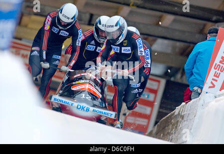 Bob pilot Maximilian Arndt and his pushers Alexander Roediger, Marko Huebenbecker and Martin Putze (Germany) start the second competition run of the four-man bob event at the bobsled World Cup in Altenberg, Germany, 08 January 2012. Again, the bob athletes finished in first place. Photo: ARNO BURGI Stock Photo