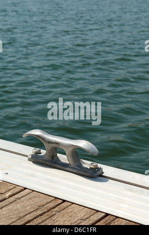 Detail of a wooden floating dock with mooring bitts Stock Photo