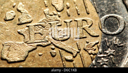 (file) - A dpa file picture dated 21 May 2010 shows a two-euro coin in Duesseldorf, Germany. On 09 January 2012, the euro touched a ten-year low due to concerns about a possible escalation of the euro crisis. The euro plunged to 1,2666 dollars. Photo: Julian Stratenschulte Stock Photo