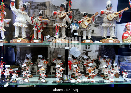 Pulcinella dolls in a shop window display, Naples, Itlay. Stock Photo