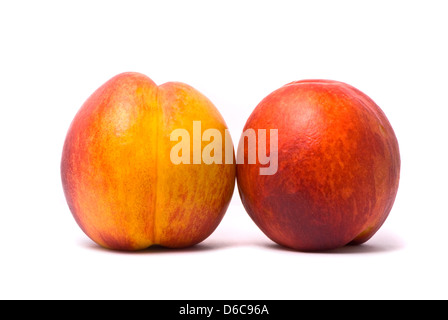 Two juicy nectarines on a white background Stock Photo