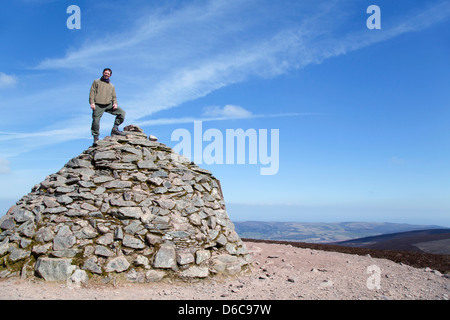 Dunkery Beacon; David Chapman on the Summit Cairn; Exmoor; UK Stock Photo