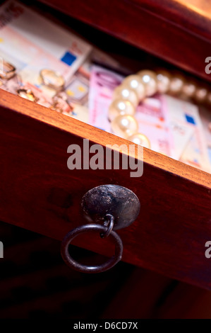 Gold euro pearls in a drower Stock Photo