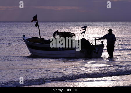 Cromer, UK. 16th April, 2013. Crab season gets underway in Cromer, UK. The Cromer crab fishermen have begun taking their pots to sea, a month later than usual. Fishing usually begins in March but the coldest March for 50 years, with sea temperatures down to four degrees centigrade, has delayed the season. The edible brown crab, Cancer pagarus, does not become properly active until the temperature gets above eight degrees. About 120 tonnes of crab are landed by Cromer’s beach-launched boats each year. Stock Photo