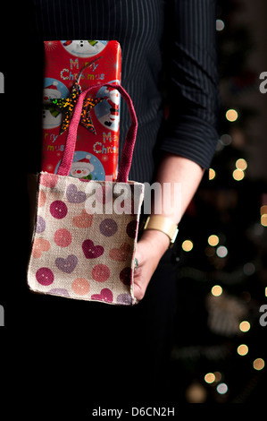 woman holding a gift. Stock Photo