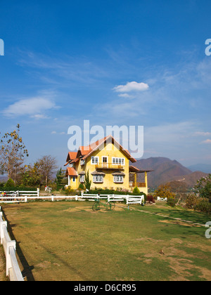 Yellow lovely house and blue sky in pai, mae hong son, thailand Stock Photo