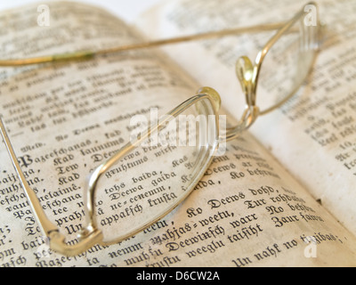 glasses on open book Stock Photo