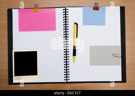 spiral notebook on wood Stock Photo