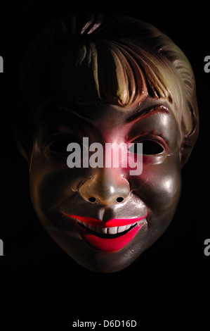 Mask of a smiling woman. Stock Photo