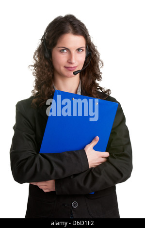 Corporate woman talking over her headset, isolated in a white background, holding a blue pad Stock Photo