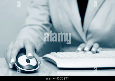 Female hands using computer Stock Photo