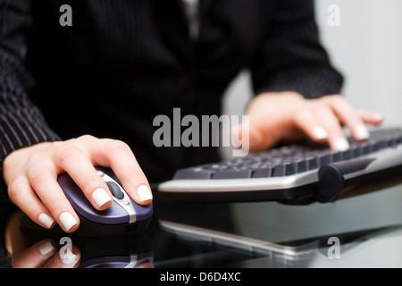 Female hands using computer Stock Photo