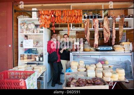 Couple selling meats at a farmer's market in Puerta Varas, Chile Stock Photo