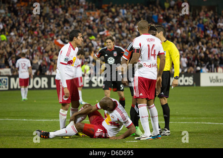 April 13th 2013, NY4 New York RedBulls Forward Thierry Henry (14) comes over to help out injured (4) Olave with (17) Cahill. Stock Photo