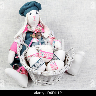 Easter Handmade Bunny with Decorated Eggs in Basket Stock Photo