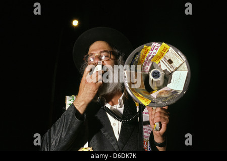 A Haredi Jew from the Habad Lubavitch sect movement shouting religious slogans through a bullhorn in Israel Stock Photo