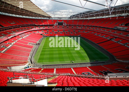 Inside Wembley football soccer stadium showing the red seats, pitch and ...