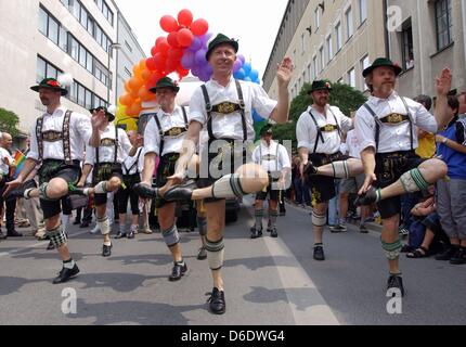 (FILE) An archive photo dated 12 July 2003 shows gay Bavarian folk dancers (Schuhplattler) dancing at the start of the 24th Christopher Street Day Parade in Munich, Germany. Schuhplattler dancers are a Bavarian tradition. For 15 years, a group of gay men have been performing the Schuhplattler dance. Photo: Maurizio Gambarini Stock Photo