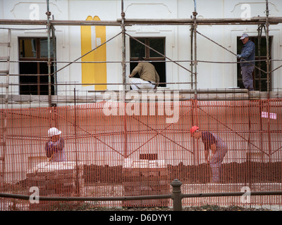 People working on a house reconstruction in Vukovar Stock Photo
