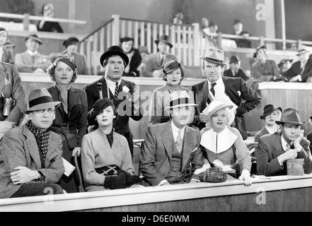 RECKLESS  1935 MGM film with Jean Harlow in white hat next to William Powell Stock Photo