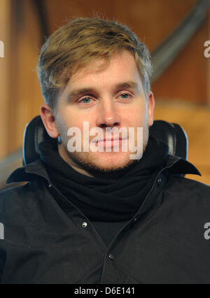 Samuel Koch is seen during a church service at the Wale Pavillon on the former Expo area in Hanover, Germany, 15 January 2012. 24 year old Koch talked about how his life changed after his accident during the ZDF television show 'Wetten, dass...?' in December 2010. Koch somersaulted over driving cars with coil springs, fell and has been paralysed from the neck downward since. Photo: Stock Photo