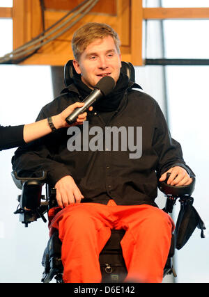 Samuel Koch is seen during a church service at the Wale Pavillon on the former Expo area in Hanover, Germany, 15 January 2012. 24 year old Koch talked about how his life changed after his accident during the ZDF television show 'Wetten, dass...?' in December 2010. Koch somersaulted over driving cars with coil springs, fell and has been paralysed from the neck downward since. Photo: Stock Photo