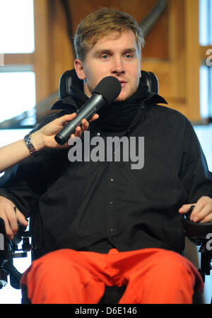 Samuel Koch is seen during a church service at the Wale Pavillon on the former Expo area in Hanover, Germany, 15 January 2012. 24 year old Koch talked about how his life changed after his accident during the ZDF television show 'Wetten, dass...?' in December 2010. Koch somersaulted over driving cars with coil springs, fell and has been paralysed from the neck downward since. Photo: Stock Photo