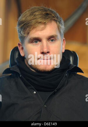 Samuel Koch is seen during a church service at the Wale Pavillon on the former Expo area in Hanover, Germany, 15 January 2012. 24 year old Koch talked about how his life changed after his accident during the ZDF television show 'Wetten, dass...?' in December 2010. Koch somersaulted over driving cars with coil springs, fell and has been paralysed from the neck downward since. Photo: Stock Photo