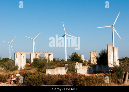 Rivesaltes Wind Farm seen over the ruined buildings of Camp de Rivesaltes in Southern France. Stock Photo