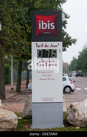 Sign outside an Ibis Hotel in France gives the daily rate for a room. Stock Photo