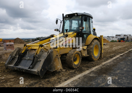 Wheeled front end loader on a residential building site. Stock Photo