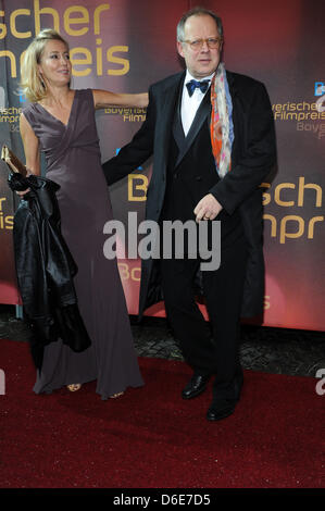 German actor Axel Milberg and his wife Judith Nicolette Krebitz arrive to the gala on the occasion of the Bavarian Film Prize awards at the Prinzregententheater in Munich, Germany, 20 January 2012. The Bavarian Film Prize is being awarded for the 33rd time for exceptional achievement in German filmmaking and are one of the most important media prizes in Germany. Photo: Ursula Duere Stock Photo