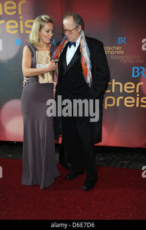 German actor Axel Milberg and his wife Judith Nicolette Krebitz arrive to the gala on the occasion of the Bavarian Film Prize awards at the Prinzregententheater in Munich, Germany, 20 January 2012. The Bavarian Film Prize is being awarded for the 33rd time for exceptional achievement in German filmmaking and are one of the most important media prizes in Germany. Photo: Ursula Duere Stock Photo