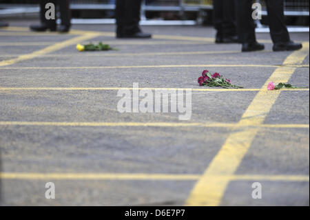 London, UK. 17th April, 2013. Flowers, thrown by well wishers lying on the road at Ludgate Circus after the gun carriage carrying Margaret Thatcher's coffin has passed by. Credit: Michael Preston/Alamy Live News Stock Photo